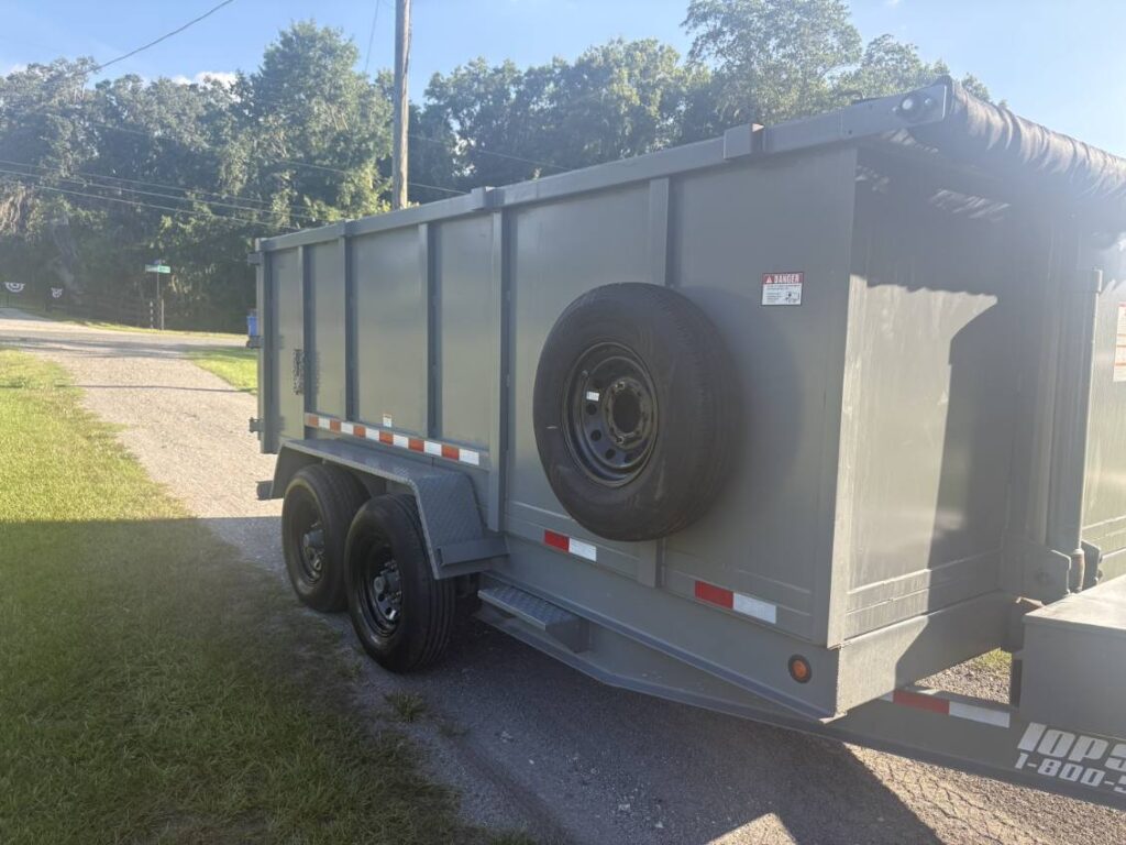 Clean 15-yard dump trailer parked in a driveway